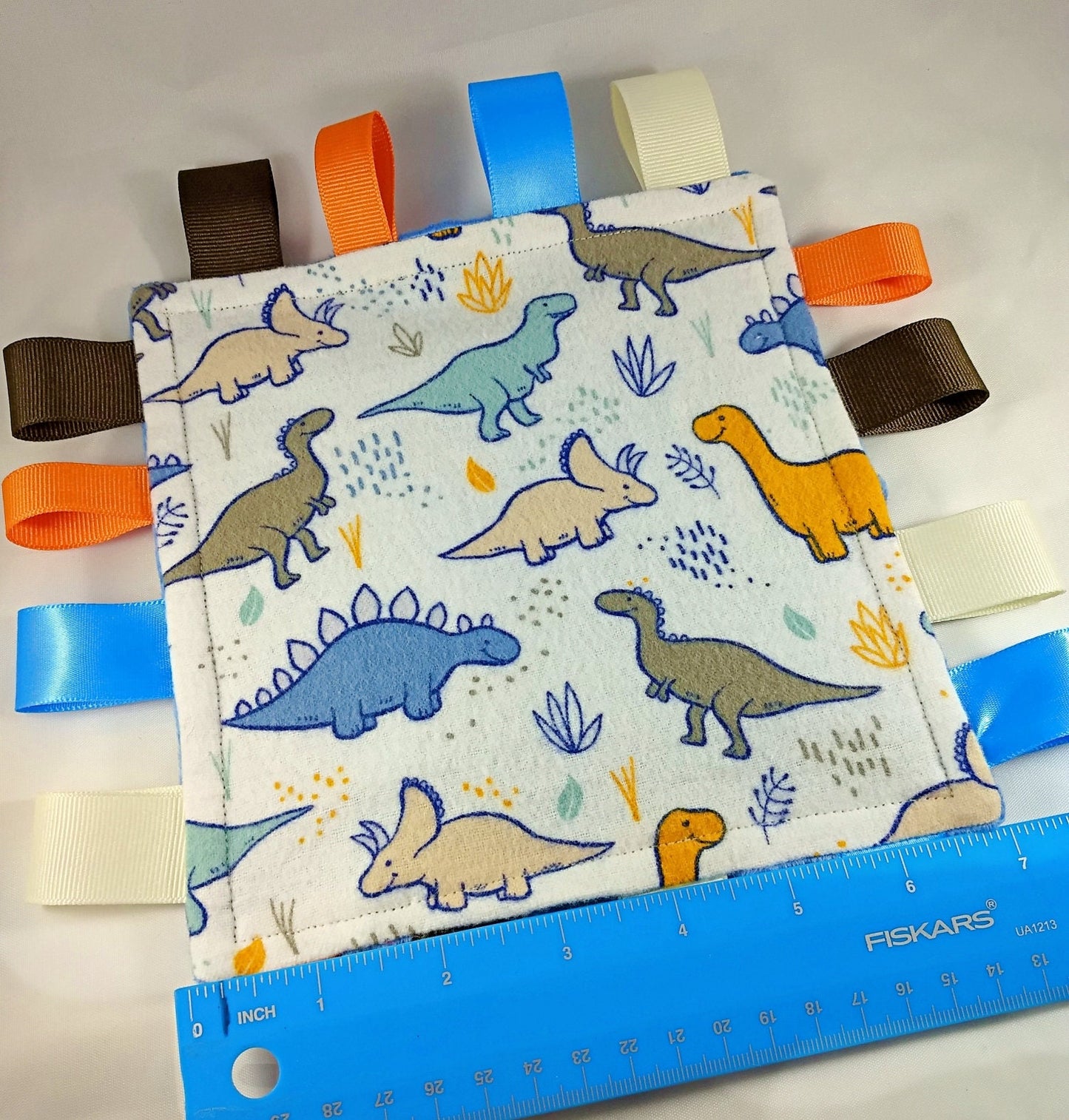 Juguete calmante con forma de dinosaurio arrugado