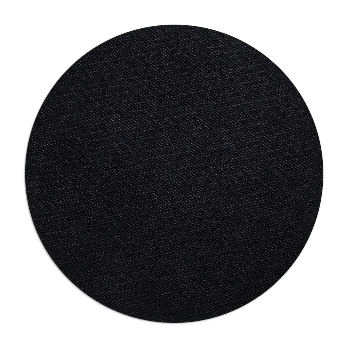 Black circular object on a white background