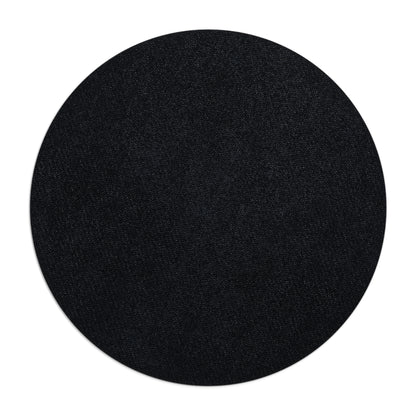 Black circular object on a white background