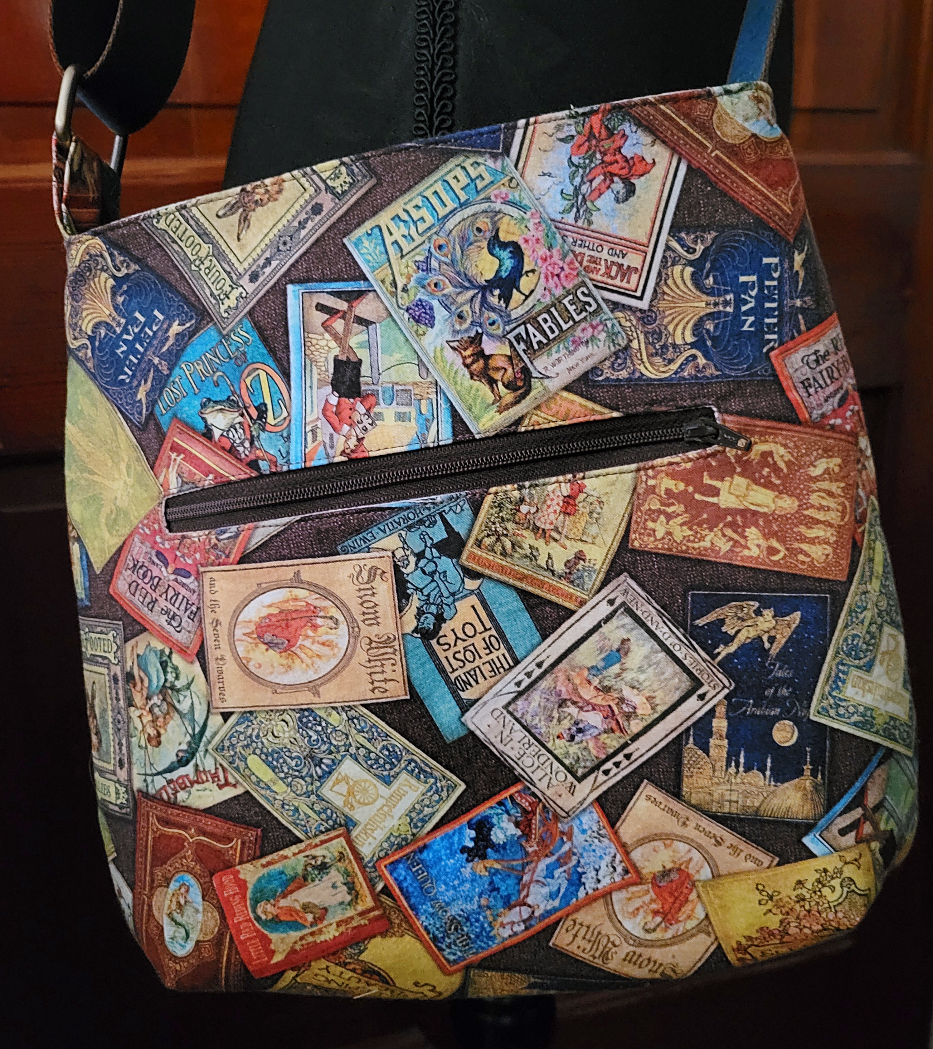 Bag with vintage-style book cover pattern on a dark background