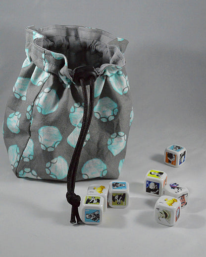 Bolsa reversible con cordón y estampado de huellas de patas